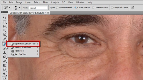 Selecting the spot healing brush tool